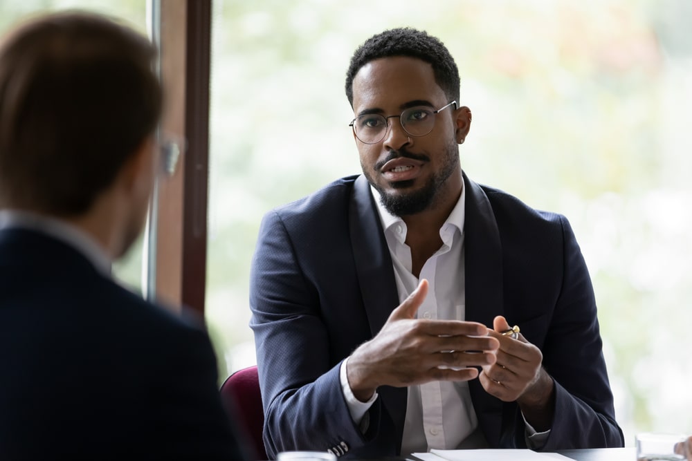 Man presenting tech security to team of financial accountants|Man presenting tech security to team of financial accountants